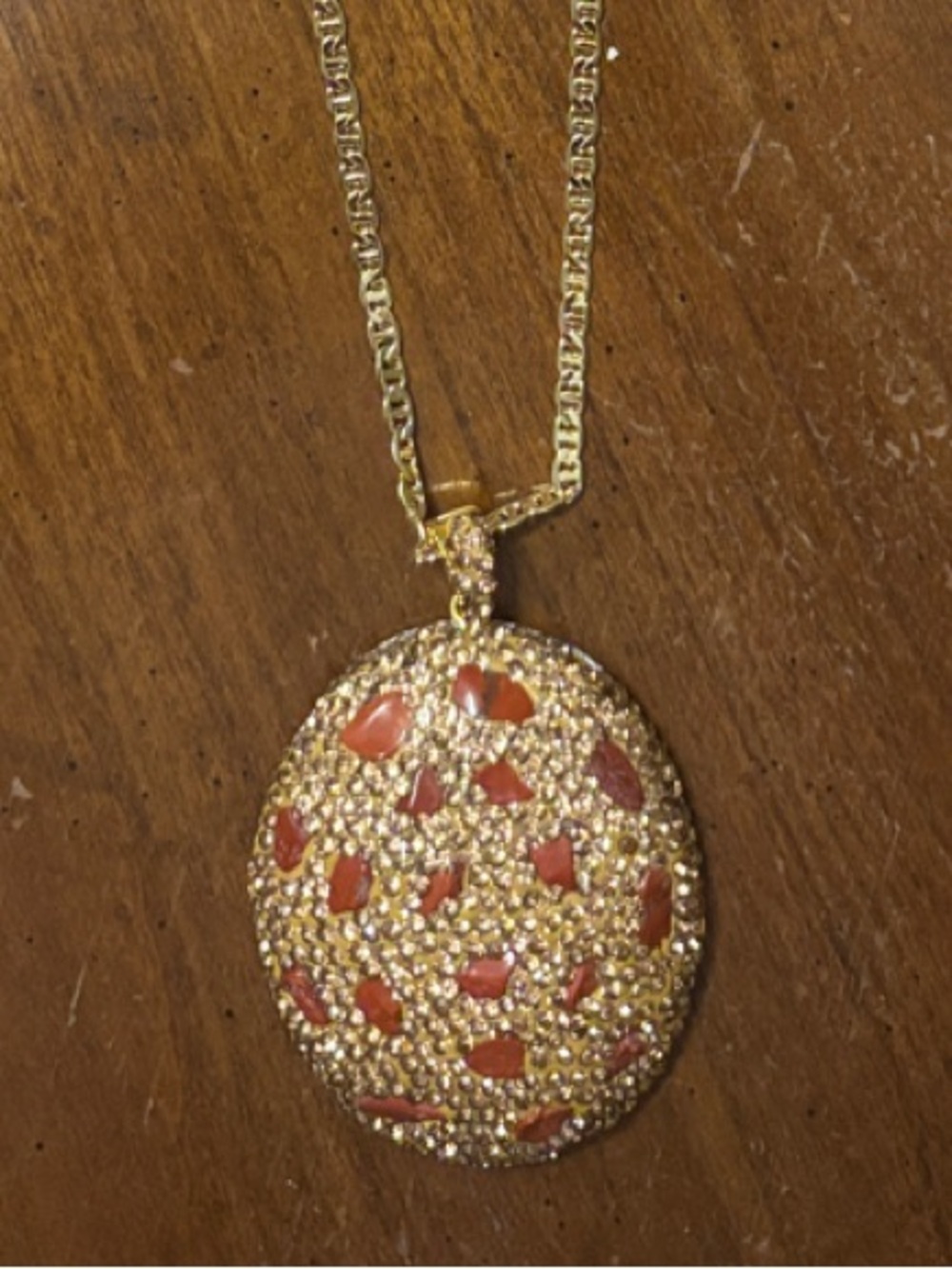 Gold-Tone Oval Pendant necklace with natural carnelian stone accents.